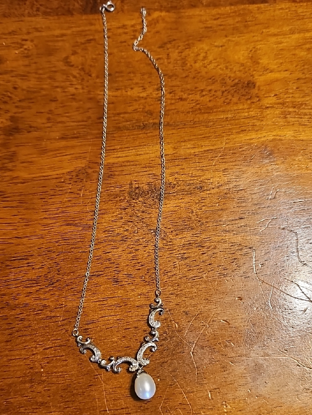 Elegant Silver-Tone Pearl Pendant Necklace with Scroll Accents